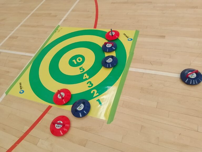 kurling stones on the target mat